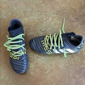 Addidas women’s/ teen girl soccer cleats in black and neon green